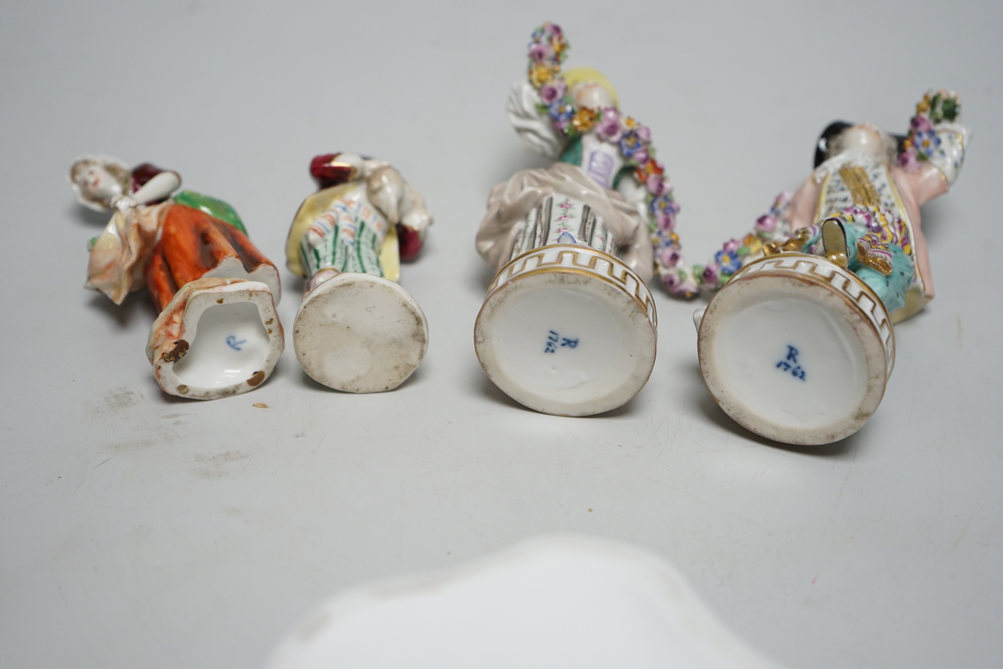 A Herend basket dish and two pairs of Continental figures